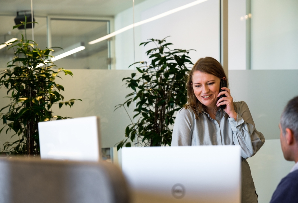 Woman on the phone in an office environment